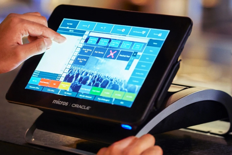 Image Showing A man pointing an object in Restaurent POS System.