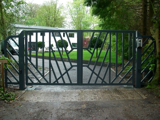 Mordern metal gate which is green colour painted in a pleasant environment